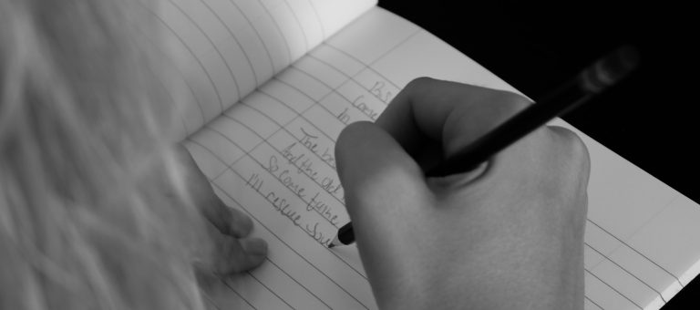 Hand writing in a notebook